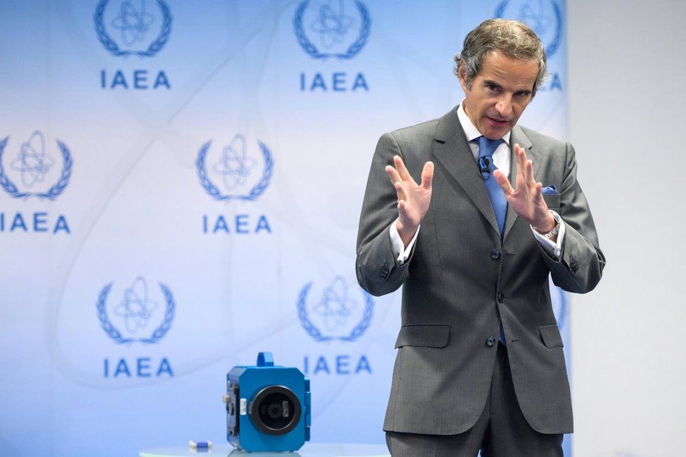 IAEA Director General Rafael Grossi speaks next to a camera at a news conference in Vienna