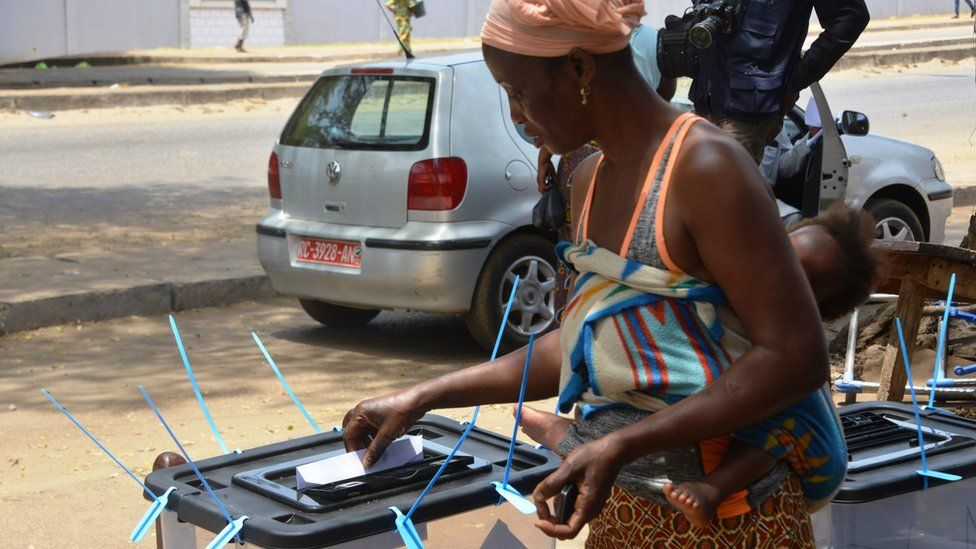 A woman cast her vote at a polling station in Conakry, Guinea - Sunday 22 March 2020