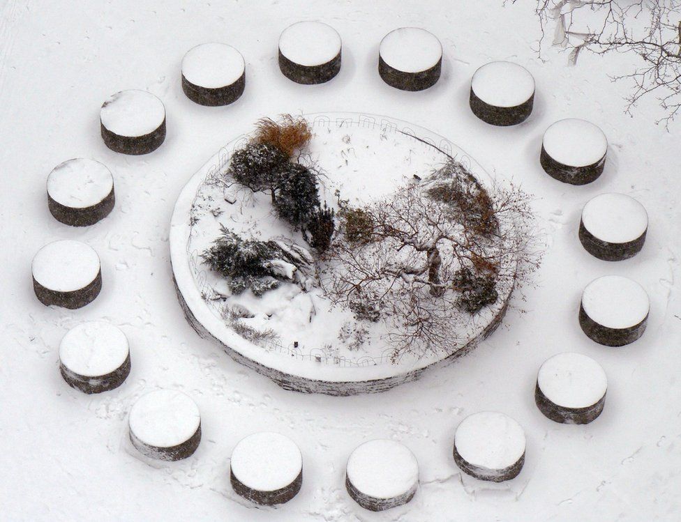 Snow on a circular plant pot