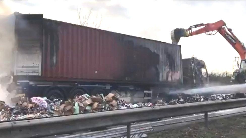 The burnt-out remains of a lorry on the A14.