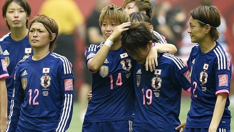 Japan's players stand on the pitch after losing the final football match between USA and Japan during their 2015 FIFA Women's World Cup at the BC Place Stadium in Vancouver on July 5, 2015. AFP PHOTO