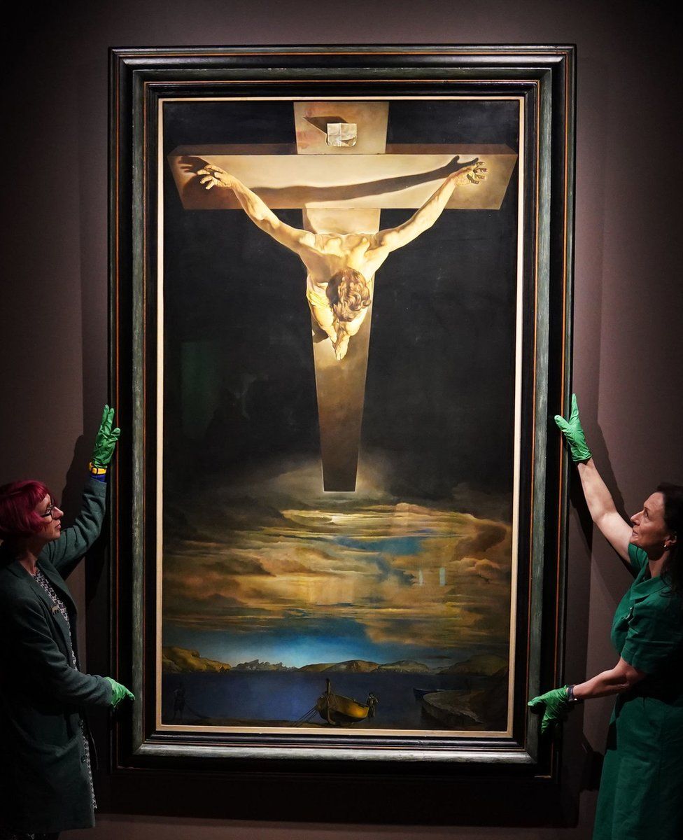 Dr Jo Meacock (left), curator from Glasgow Art Museum and Morlin Ellis, curator at the Spanish Gallery in Bishop Auckland during the installation of Salvador Dali's painting Christ of St John of the Cross at the Spanish Gallery in Bishop Auckland, County Durham.