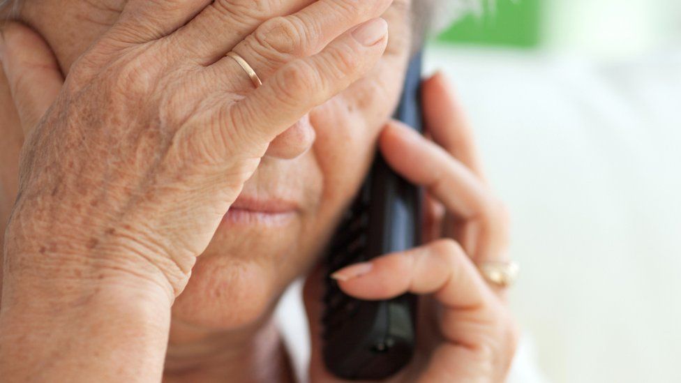 stock image of an older person on the phone