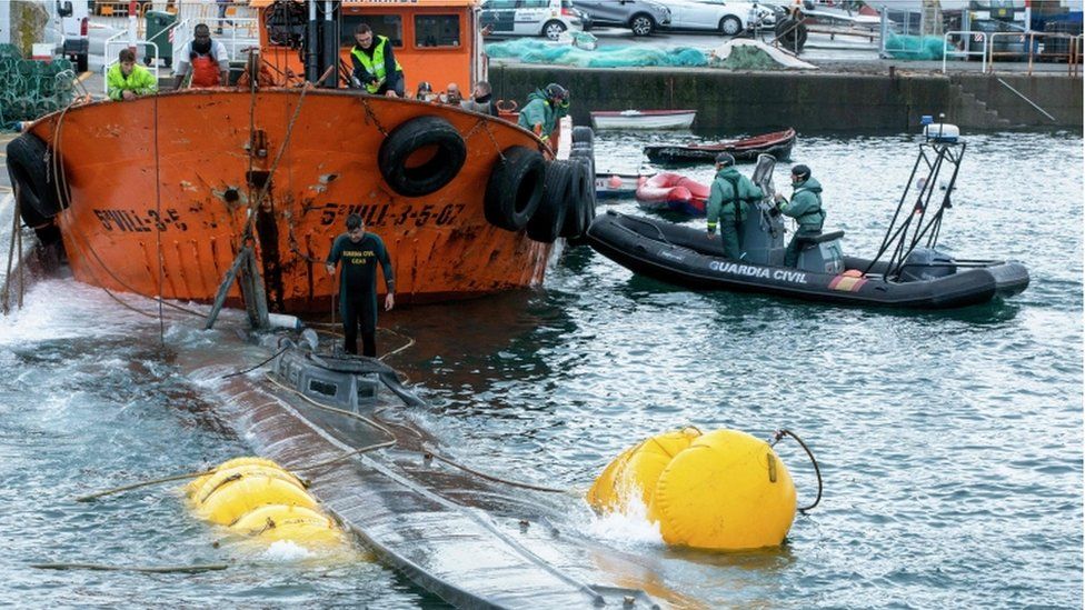 Guardia Civil divers inspect the suspected narco-submarine in Aldán, Galicia
