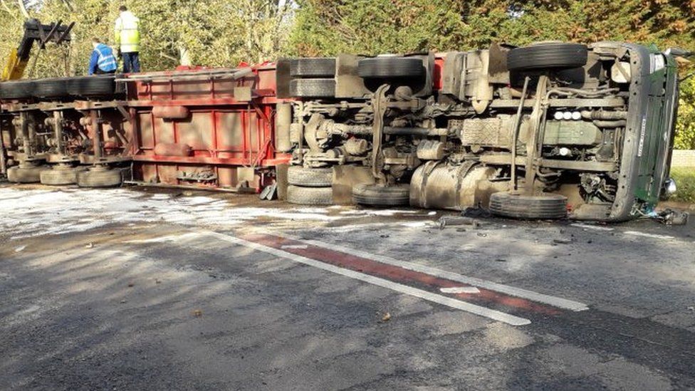 Overturned lorry.