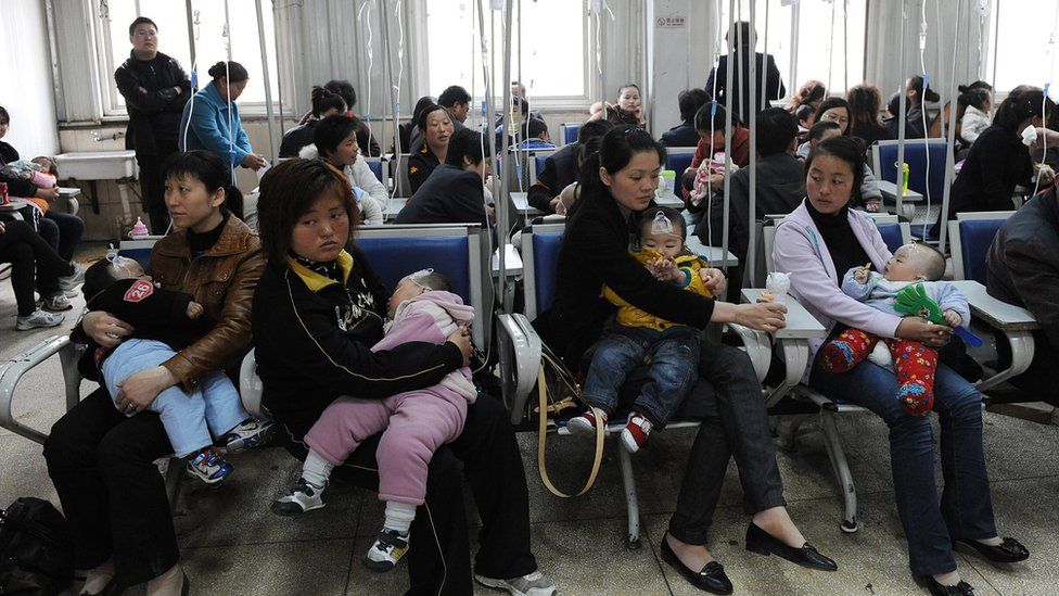 Chinese families accompany their children as they get various injections from flu to rabies shots at a hospital in Hefei,