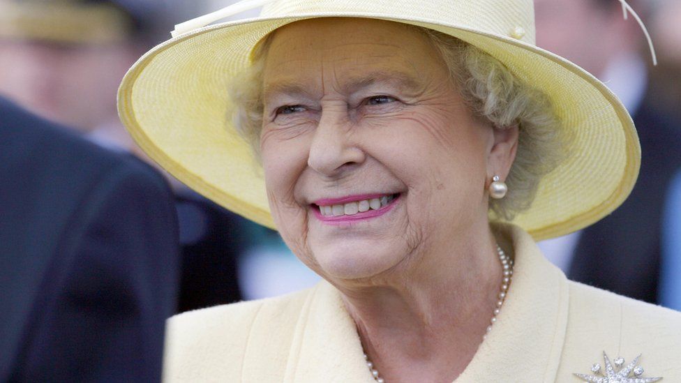 A smiling Queen greets guests during a garden party in Coleraine, Northern Ireland in June 2007 during an one-day visit to Northern Ireland