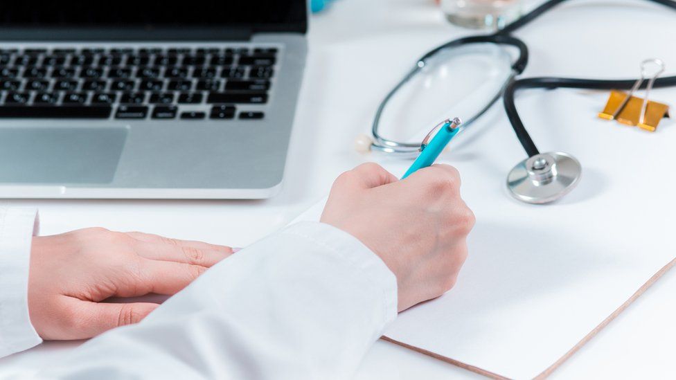 Doctor writing letter