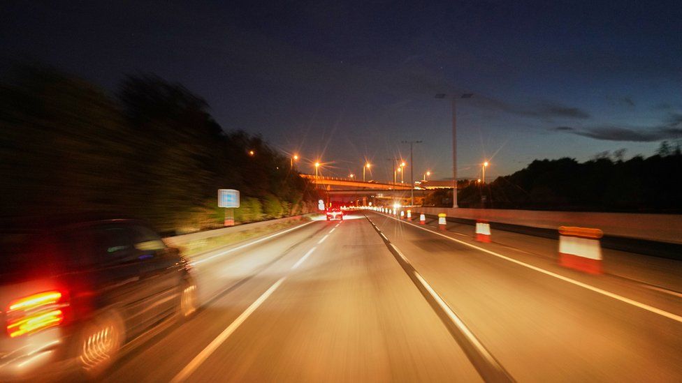A stock image of motorway driving at night