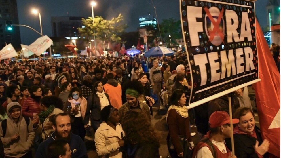 "Temer out" reads a banner at an opposition march in Sao Paulo