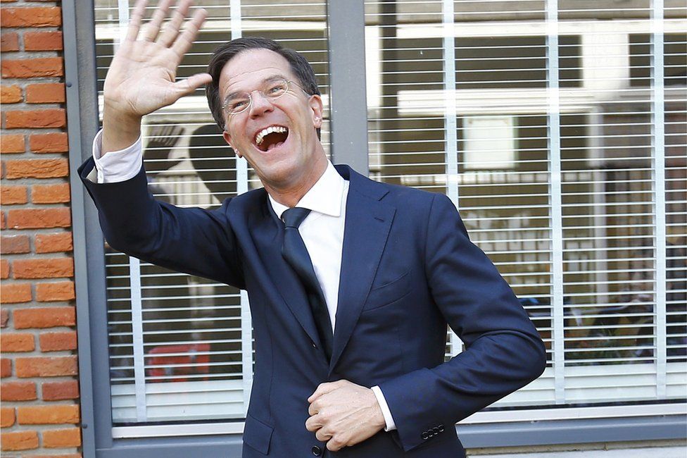 Mark Rutte waves after voting in the general election in The Hague, Netherlands, 15 March