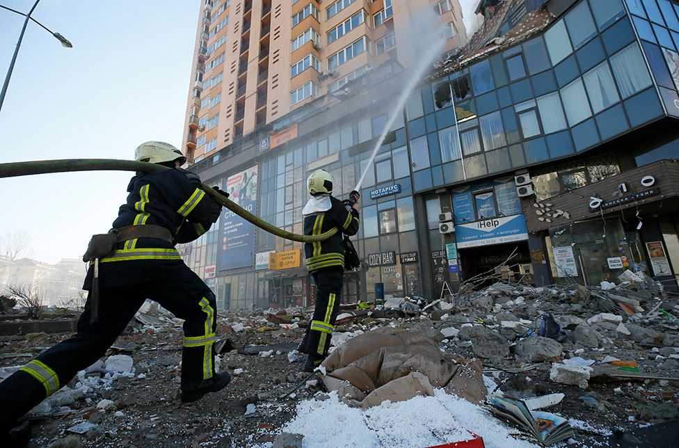 Firefighters extinguish fire in an apartment building damaged by recent shelling in Kyiv, Ukraine February 26, 2022.