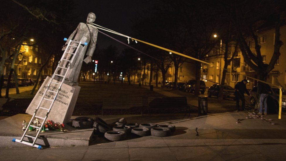 The monument of the late priest Henryk Jankowski is pulled down by activists in Gdansk, Poland, 21 February 2019