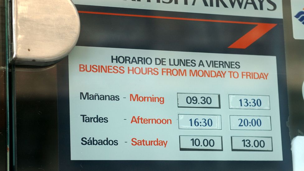 Palma de Mallorca, Spain. Opening hours at a travel agent allow for an afternoon siesta.