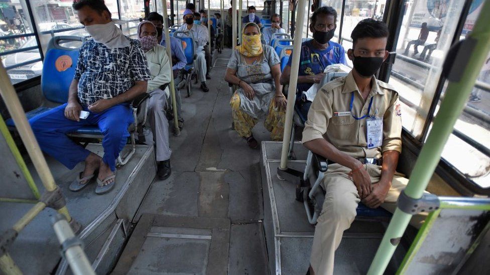 Passengers maintaining social distance as they are on board in a DTC Bus after government eased lockdown restriction, at AIIMS on May 20, 2020 in New Delhi, India.