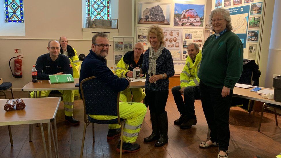 Civil defence members with the vicar in Christ Church Laxey
