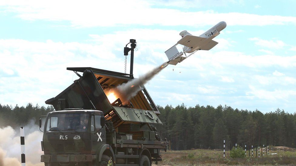 A KZO reconnaissance drone of the Bundeswehr, the German armed forces, launches with the help of a booster rocket during Thunder Storm 2018 multinational Nato military exercises on June 7, 2018 near Pabrade, Lithuania.