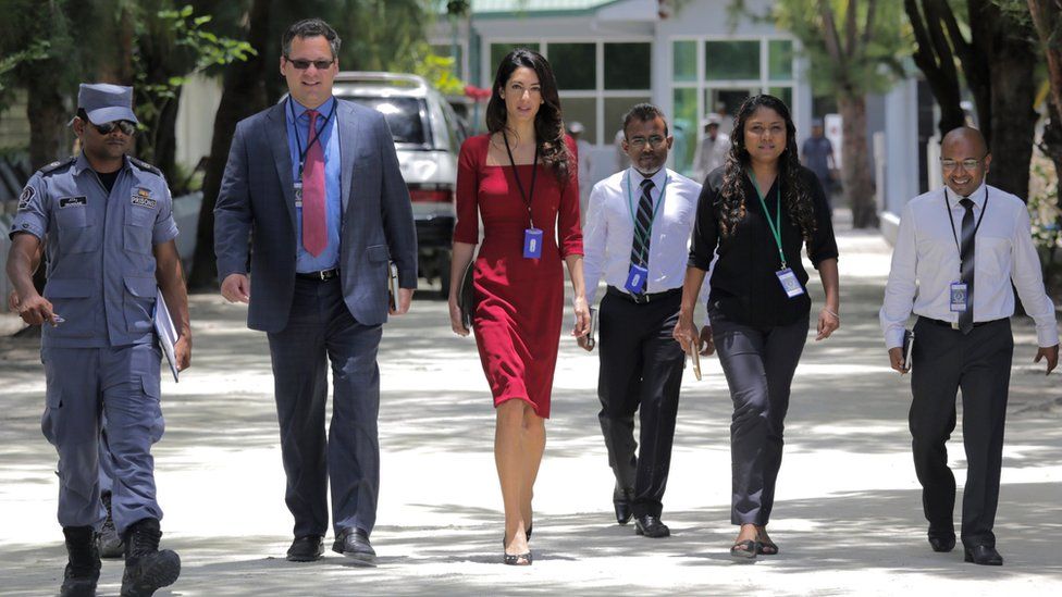 Human rights lawyer Amal Clooney (C) leaves the Maafushi Prison in Maafushi, some 27 km from the capital Male, on September 10, 2015.