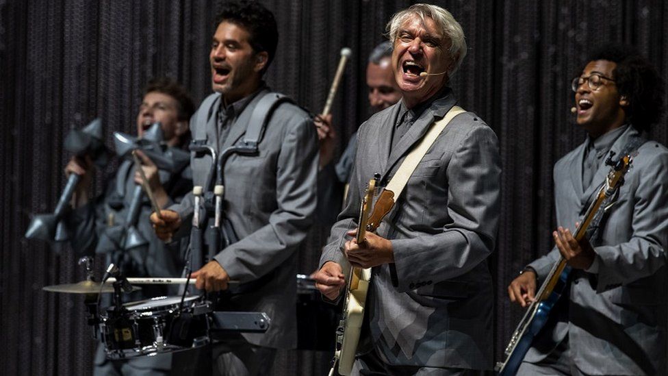 David Byrne performing with his band in Milan in 2018