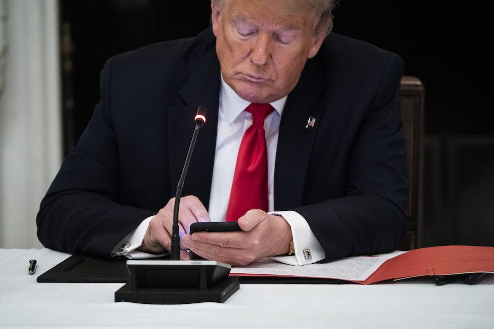 Trump using a cellphone