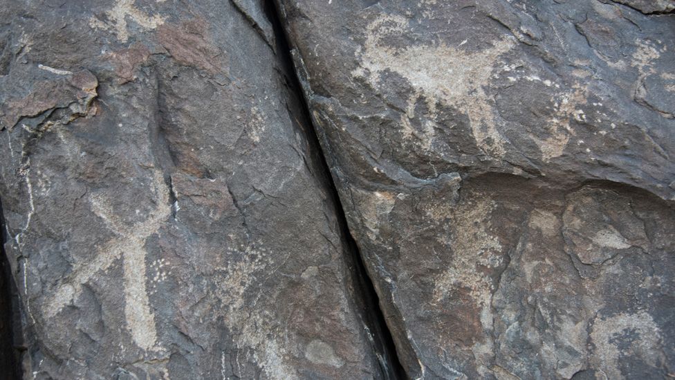A close-up view of the petroglyphs showing animals with horns