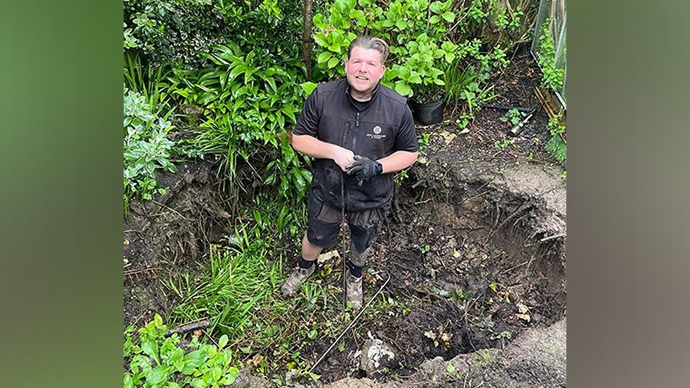 Nick Whittle of NFW Landscapes and Paving in the sinkhole