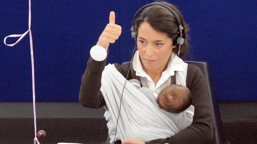 Licia Ronzulli sits with her baby daughter as she votes in the European Parliament in 2010