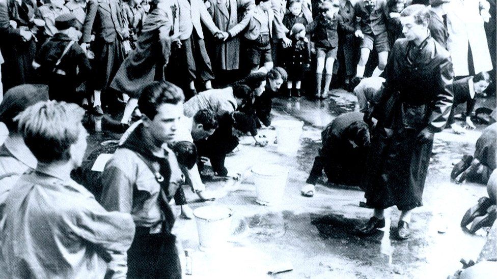 Austrian Jews forced to wash a street in Vienna following the German Anschluss (Annexation) of Austria in 1938