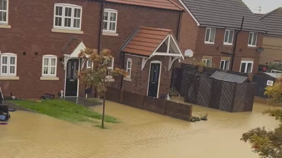 Flooding outside homes on Pitsford Close on 20 October