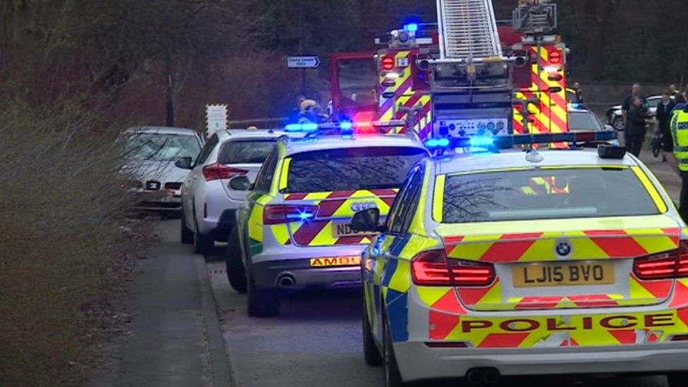 Police and fire engines at the scene of a crash