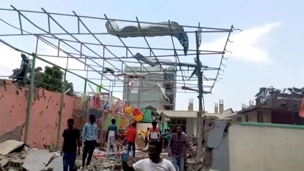 People inspect a damaged playground following an air strike in Mekelle, the capital of Ethiopia"s northern Tigray region, August 26, 2022 in this still image taken from video