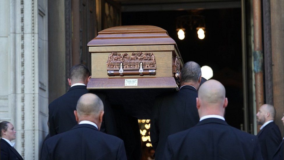 The coffin arriving at Westminster Cathedral