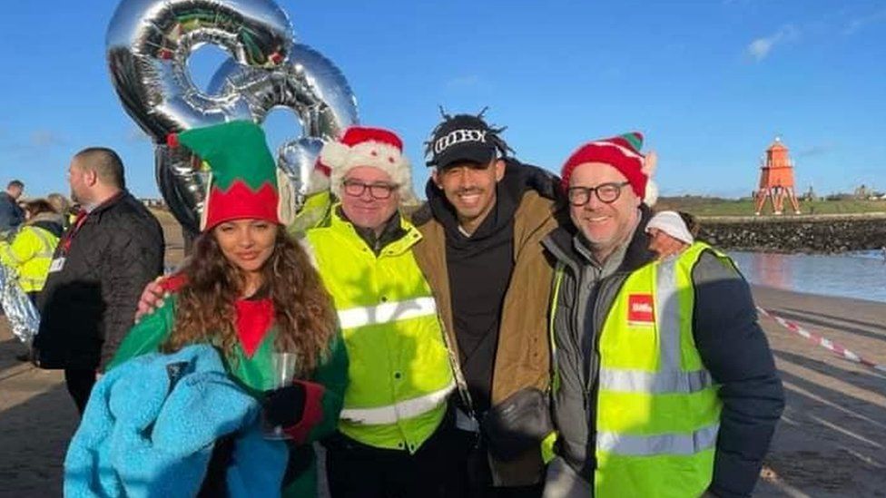 Jade Thirlwall with boyfriend Jordan Stephens and volunteers at the event