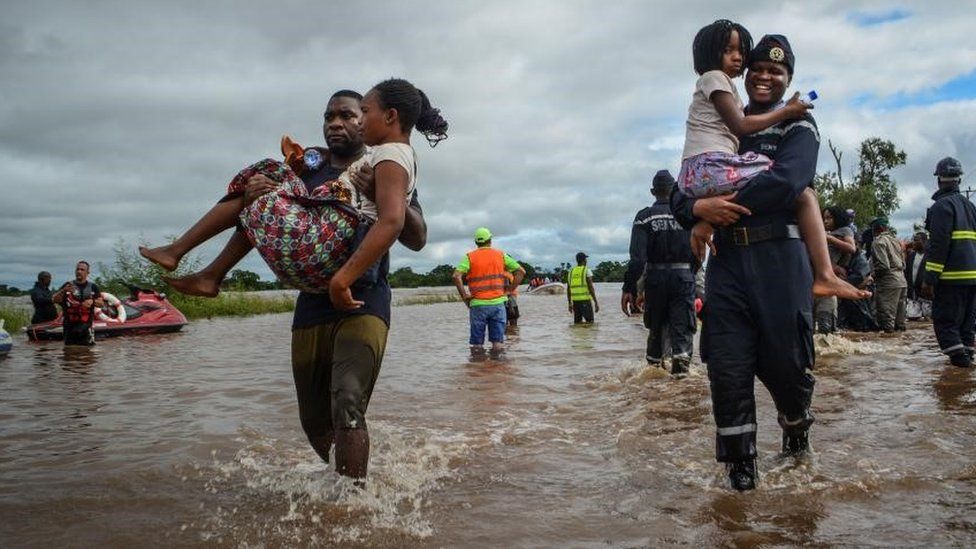 Locals are evacuated from flooded areas in Maputo, Mozambique, 11 February 2023. More than 300 people were rescued boats of the authorities, companies and individuals who have pulled them out of trees, roofs of houses or pieces of land that remained as islands. According to Mozambique's National Institute for Disaster Management (INGD) about 2,400 families have been affected with many of those in a critical situation.