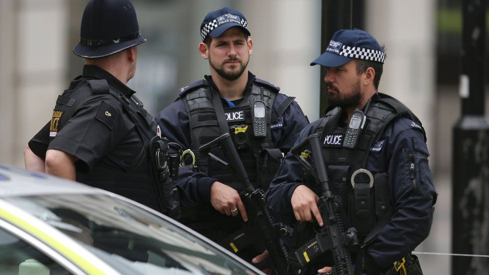 Armed officers standing near London Bridge in 2017