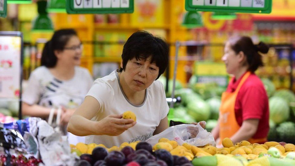 People purchase at a super market on June 9, 2018 in Fuyang, Anhui Province of China.