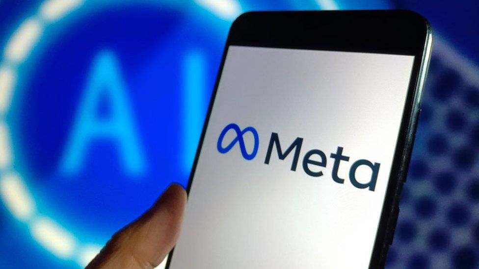 Meta logo on a phone in front of a sign which says AI