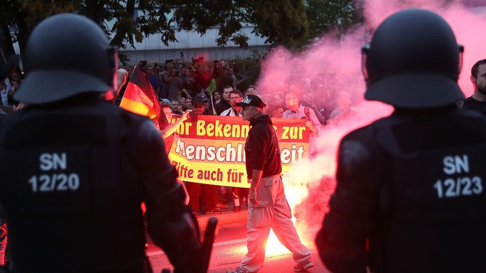 Police watch right-wing protesters in Chemnitz