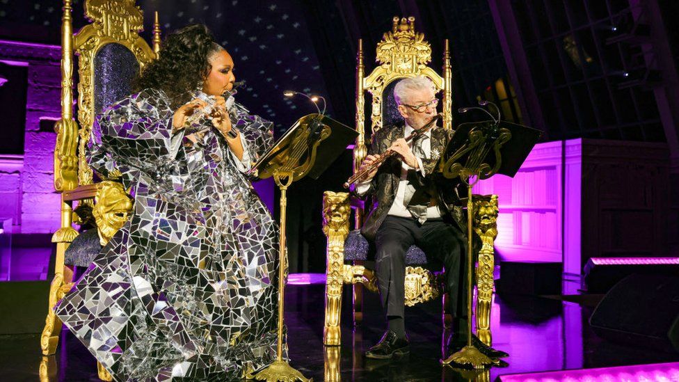 Lizzo and Sir James Galway beryllium   connected  golden  thrones arsenic  they execute  a flute duet astatine  the Met Gala