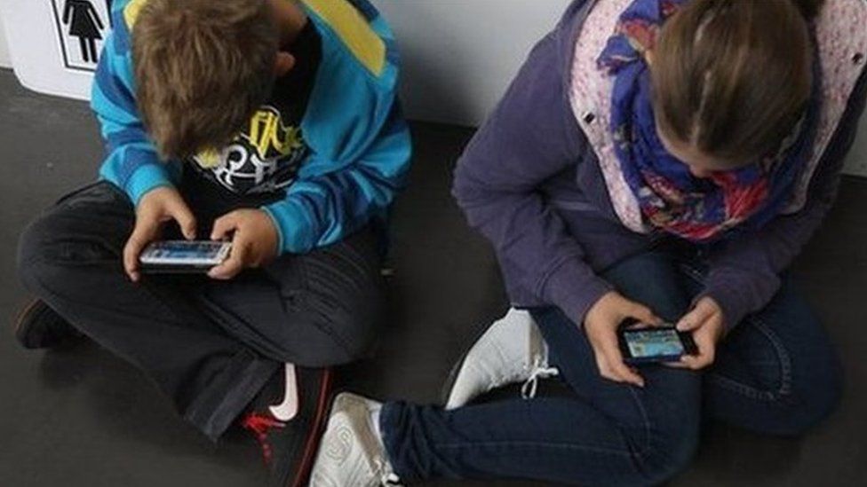 Children using mobile phones