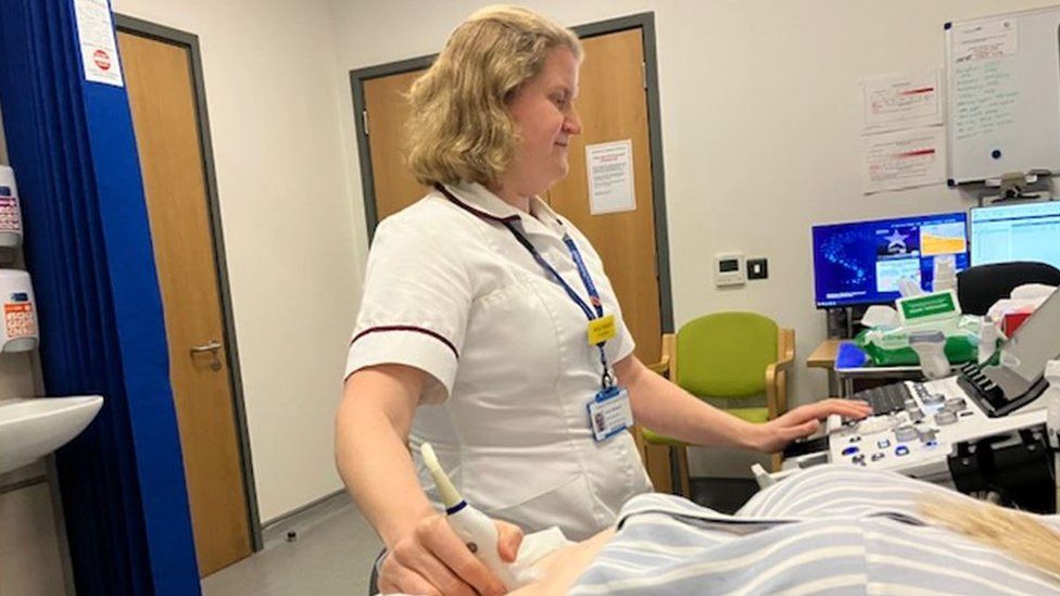 Amie Whittard – Specialist Radiographer checks out a patient using ultrasound