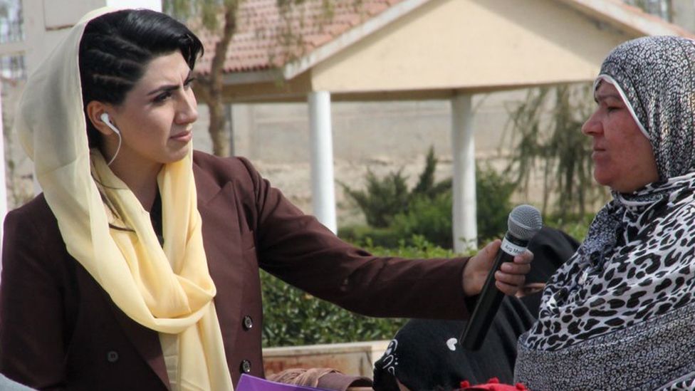 Shazia Haya interviewing a woman in Afghanistan before she left the country