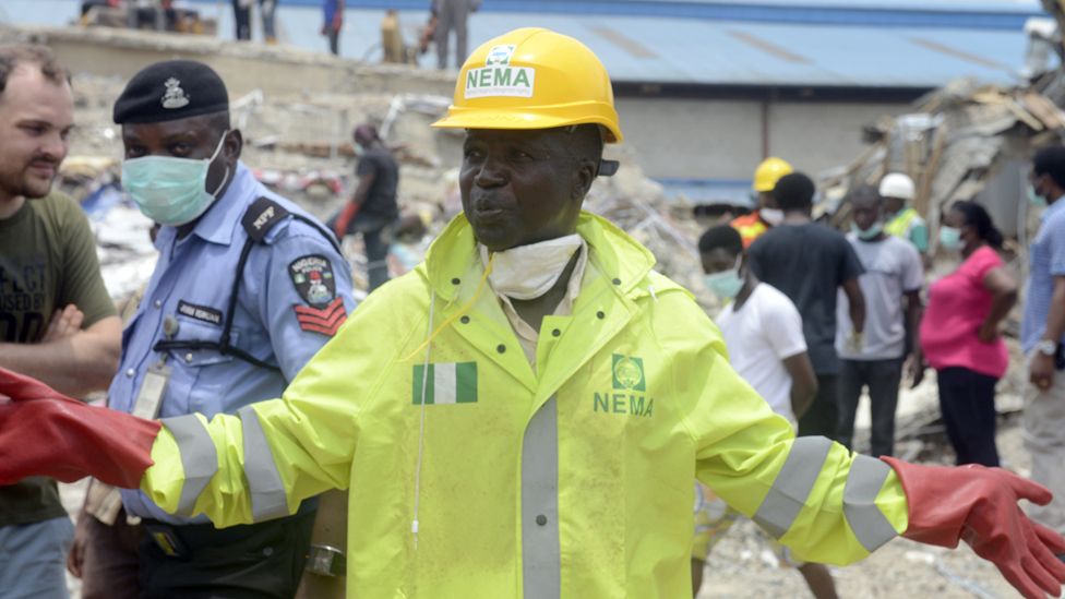 A National Emergency Management Authority spokesperson speaks at the scene of the collapsed church guesthouse of the Synagogue Church of All Nations in Lagos, Nigeria - 17 September 2014.
