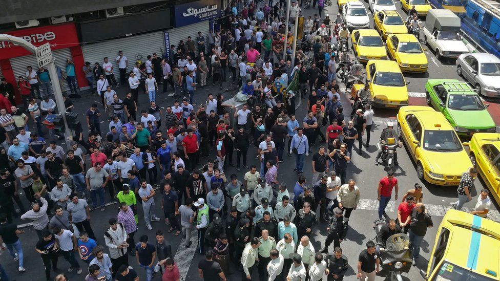 People gather during a protest against the collapse of Iran's currency in central Tehran (25 June 2018)