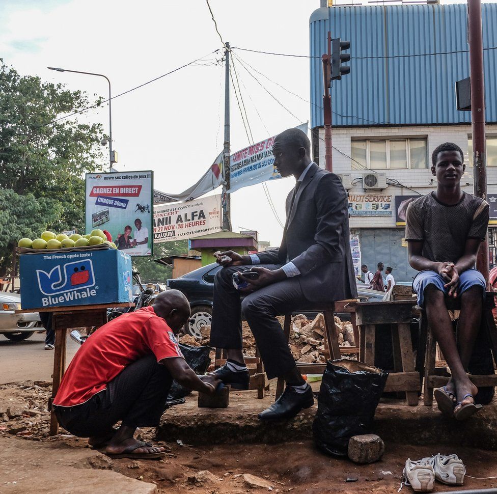 An accountant getting his shoes shined