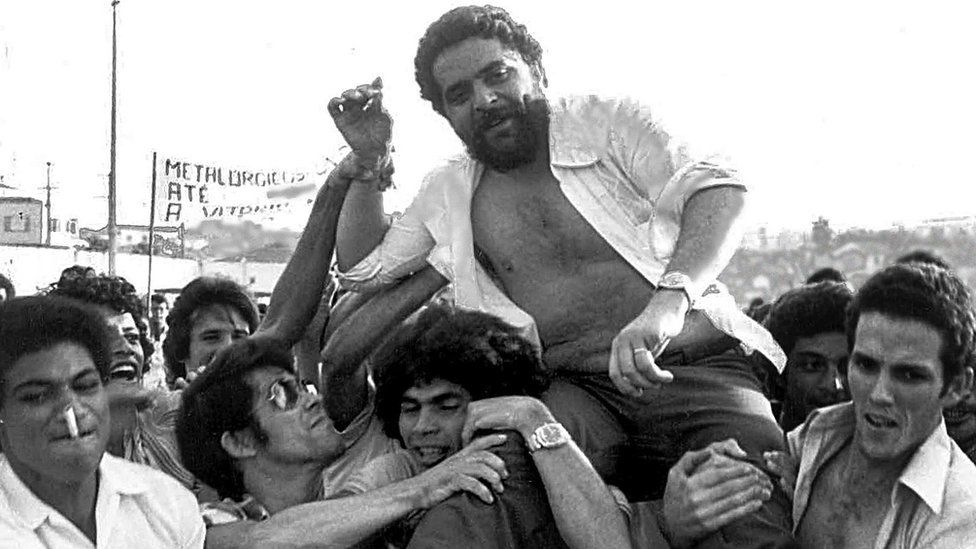 This 22 March 1979 file photo shows Luiz Inacio Lula da Silva being lifted by metalworker colleagues after a union rally in Sao Bernardo do Campo, 55kms from Sao Paulo. Da Silva, presidential candidate for the Workers' Party, has been declared the winner of the presidential election run-off 27 October, 2002.