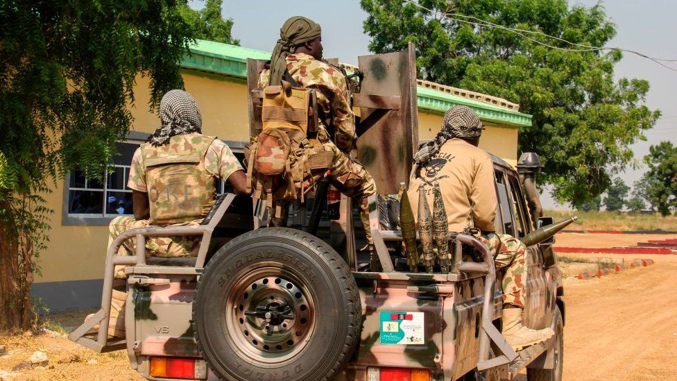 Nigerian Army soldiers are seen driving on a military vehicle in Ngamdu, Nigeria, on November 3, 2020