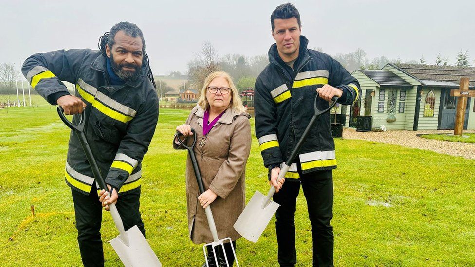Gladiators star Saracen, also known as Michael Lewis, with Jude Deakin and Lee Phillips using spades and forks to break ground for the firefighter memorial