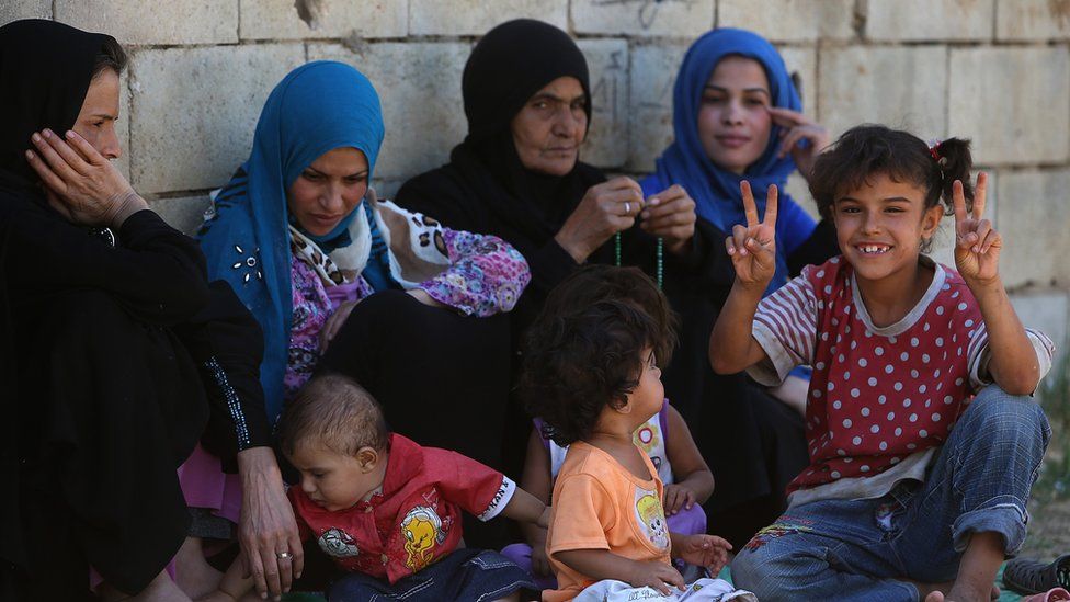 Syrian refugee family at a temporary refugee camp, in the eastern Lebanese Town of Al-Faour, 2013