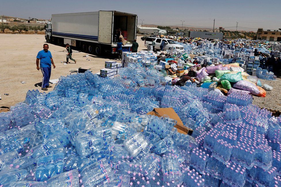 Humanitarian aid for Syria is prepared in the town of Ramtha, Jordan, 2 July 2018